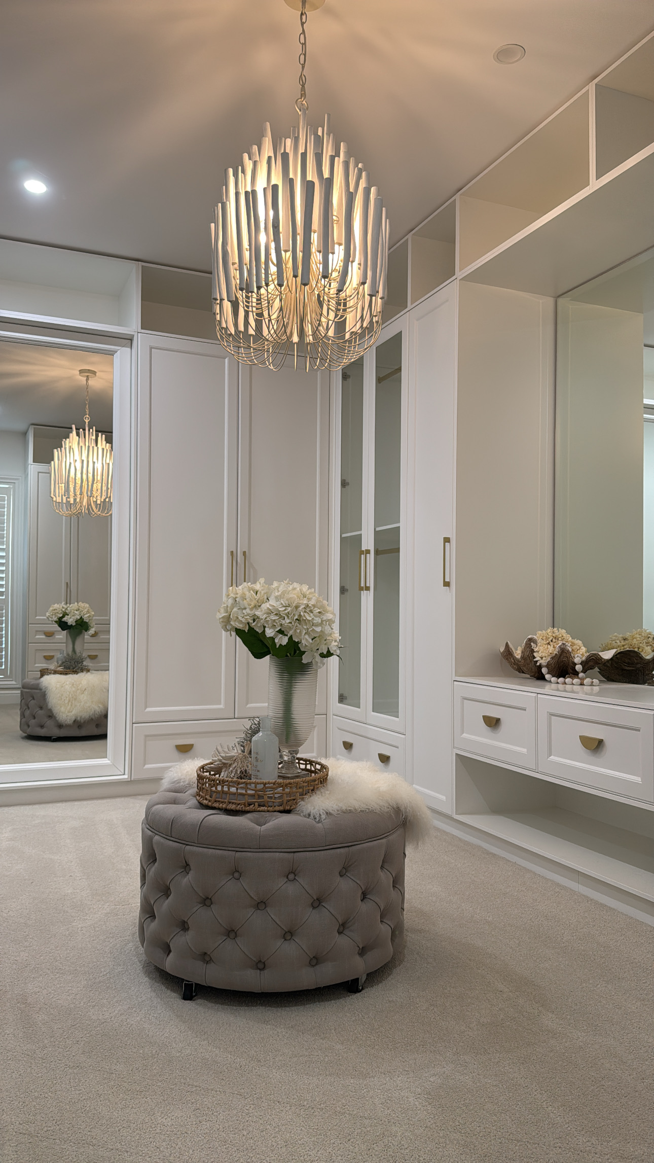 Custom wardrobe cabinetry with mirrored doors and premium handles