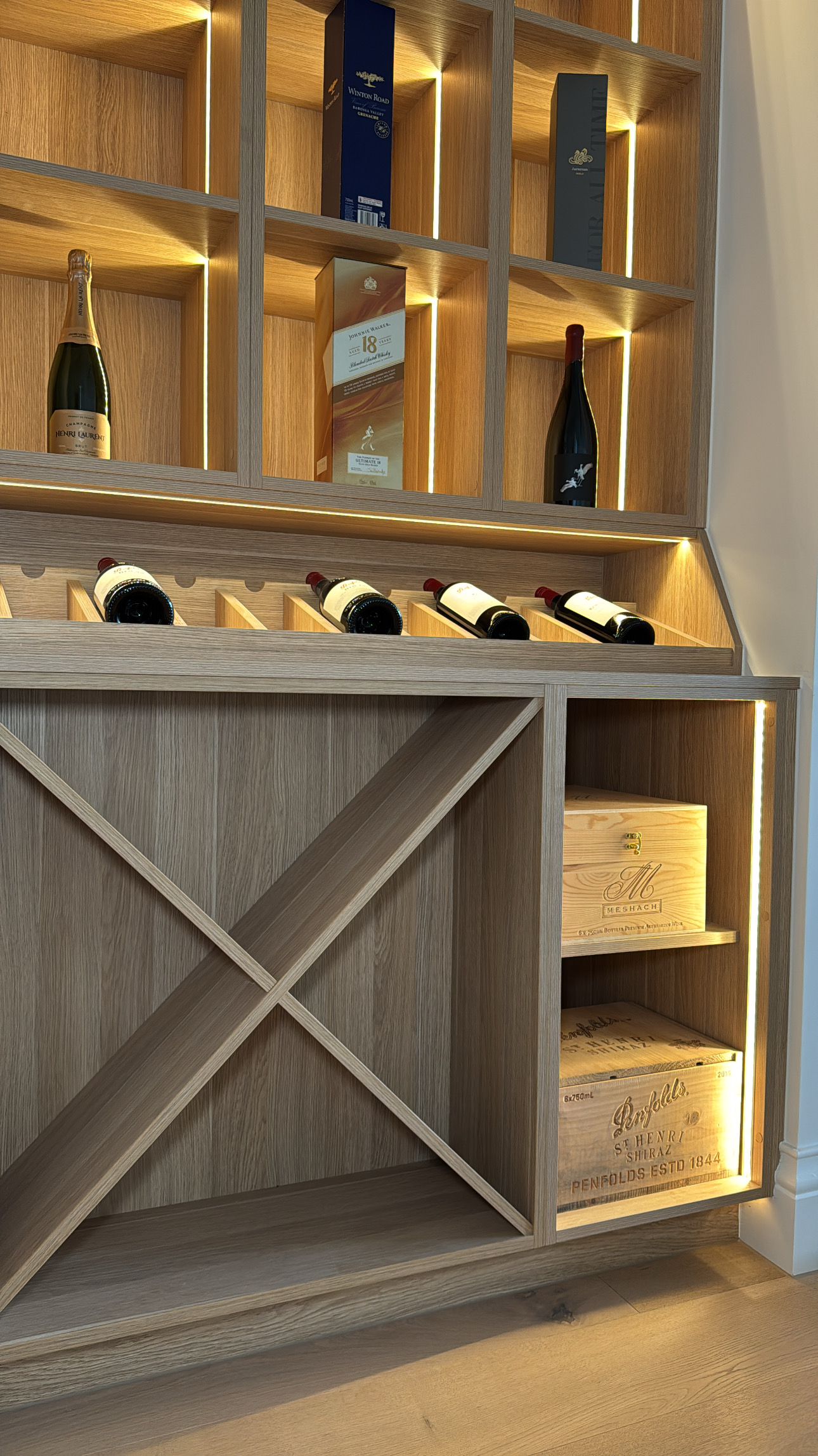 Custom wine display cabinetry with lighting